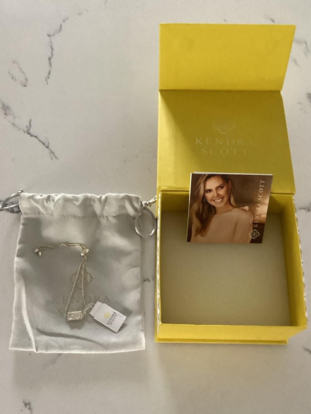Kendra Scott Silver Necklace with White Pouch and Yellow Box